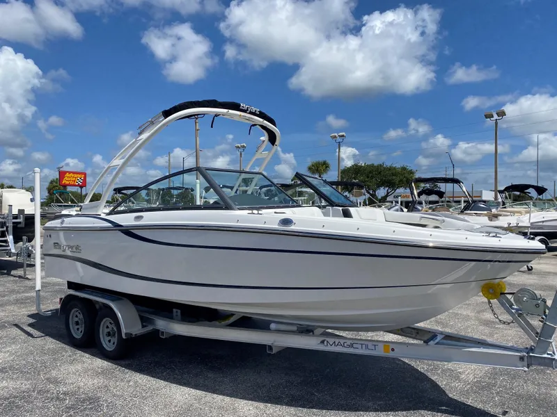Slide: The Image of 2019 Bryant Speranza boat on a trailer in a marina under a blue sky. - 7