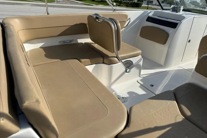 Slide: The Image of 2021 Bayliner VR6 Bowrider OB interior with tan seating and sleek design. - 12