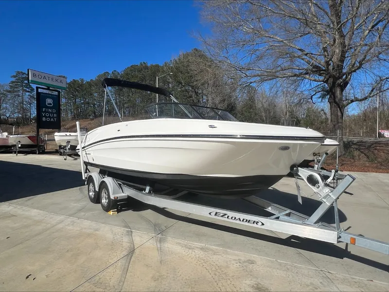 Slide: The Image of 2021 Bayliner VR6 boat on EZ Loader trailer at dealership. - 4