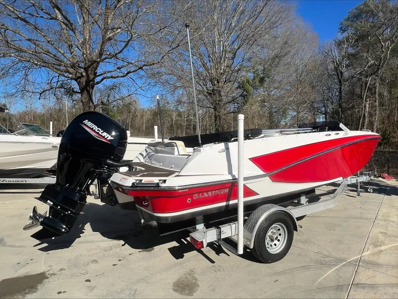 Slide: The Image of 2019 Glastron GT 200 red and white boat on EZ Loader trailer at Boateka. - 3