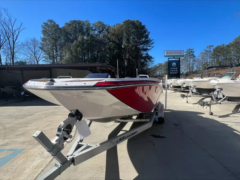 Slide: The Image of 2019 Glastron GT 200 boat interior with white seating and steering console. - 7