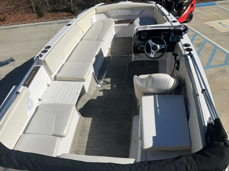 Slide: The Image of 2019 Glastron GT 200 boat interior with white seating and spacious layout. - 8