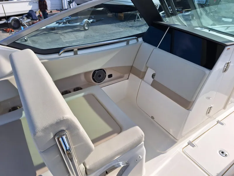 Slide: The Image of 2022 Boston Whaler 240 Vantage boat interior with seating and storage compartments. - 4