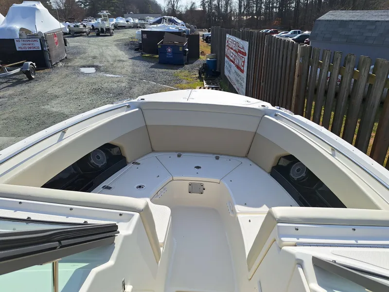 Slide: The Image of 2022 Boston Whaler 240 Vantage boat bow view in a storage yard. - 7