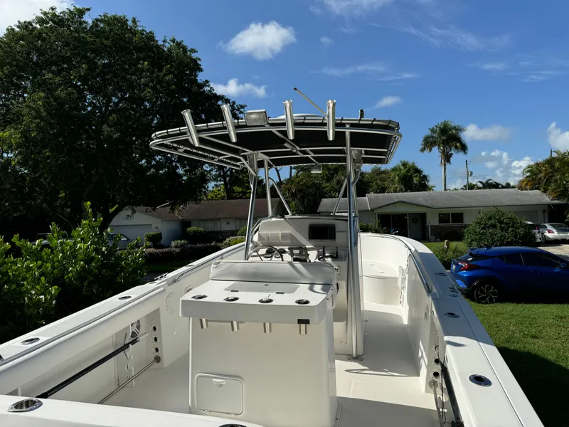 Slide: The Image of Edgewater 260 Center Console boat, 2002 model, parked outdoors on a sunny day. - 21