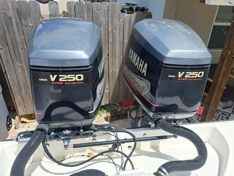 Slide: The Image of Twin Yamaha V250 outboard engines on a 2002 Edgewater 260 Center Console boat. - 23