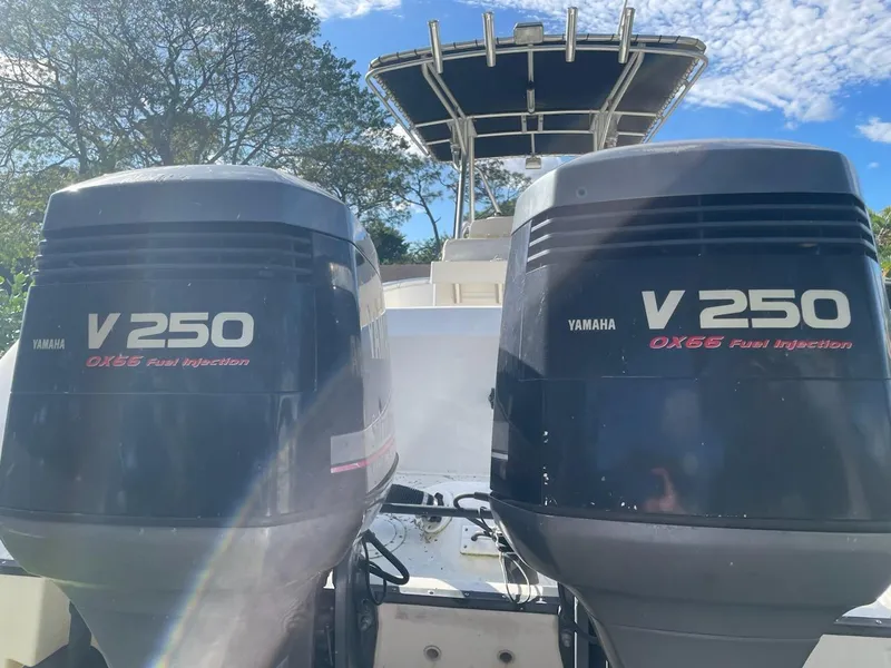 Slide: The Image of 2002 Edgewater 260 Center Console with twin Yamaha V250 outboard engines. - 24