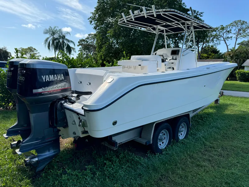 Slide: The Image of 2002 Edgewater 260 Center Console boat with Yamaha outboard motor on trailer. - 3