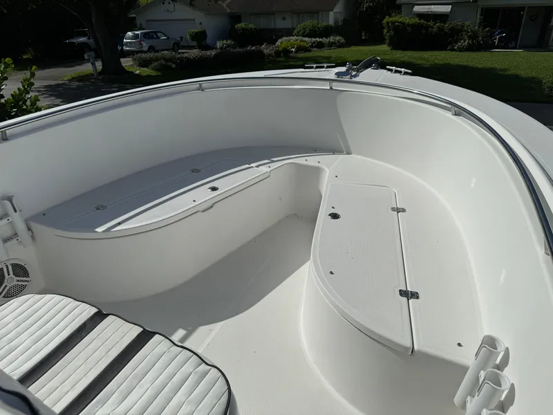 Slide: The Image of Edgewater 260 Center Console 2002 boat interior with seating and storage compartments. - 7