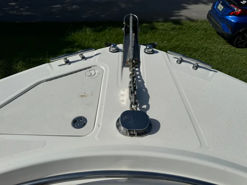 Slide: The Image of Bow of 2002 Edgewater 260 Center Console with anchor chain and cleats. - 9