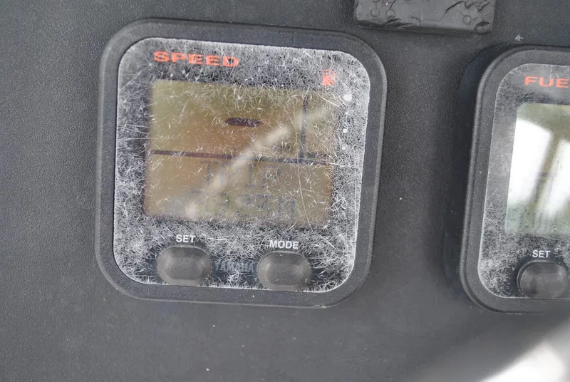 Slide: The Image of Speed and fuel gauges on a 2001 ProKat 2800KAT boat dashboard. - 10