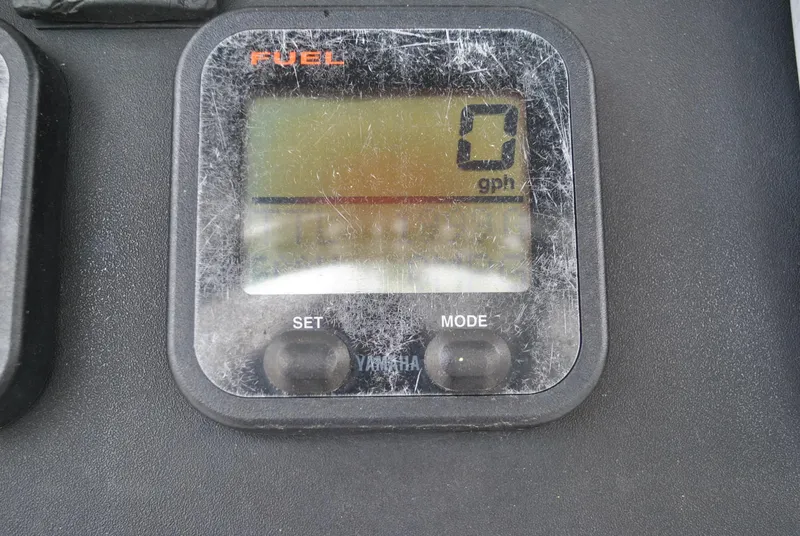 Slide: The Image of Fuel gauge display on 2001 ProKat 2800KAT boat, showing zero gallons per hour. - 12