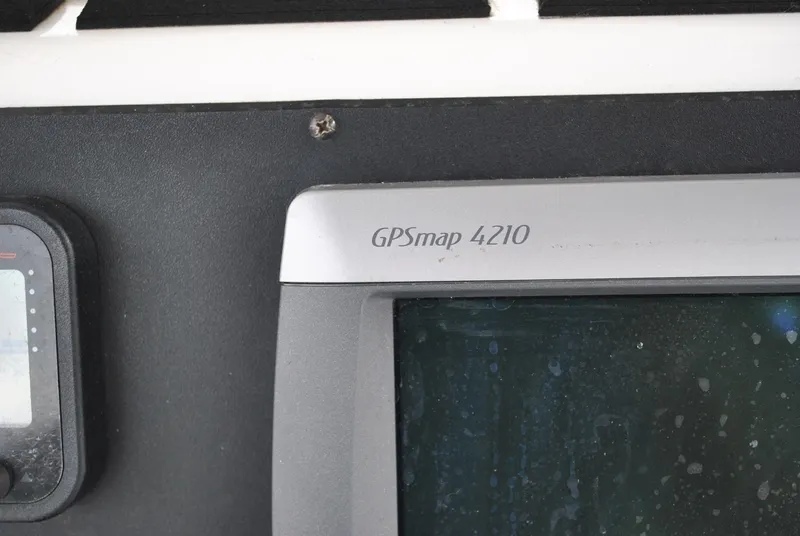 Slide: The Image of Close-up of GPSmap 4210 on 2001 ProKat 2800KAT boat dashboard. - 14