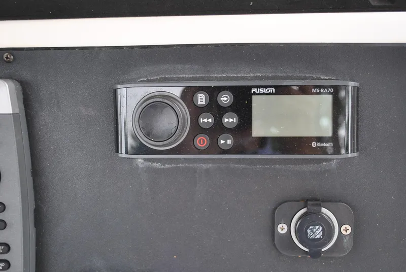 Slide: The Image of Fusion MS-RA70 Bluetooth stereo system on 2001 ProKat 2800KAT boat dashboard. - 15