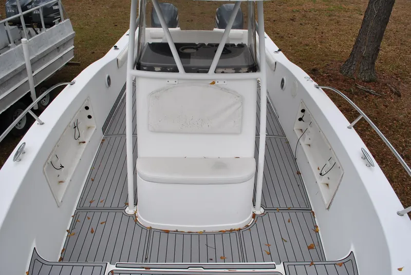Slide: The Image of 2001 ProKat 2800KAT boat deck with seating and storage compartments. - 5
