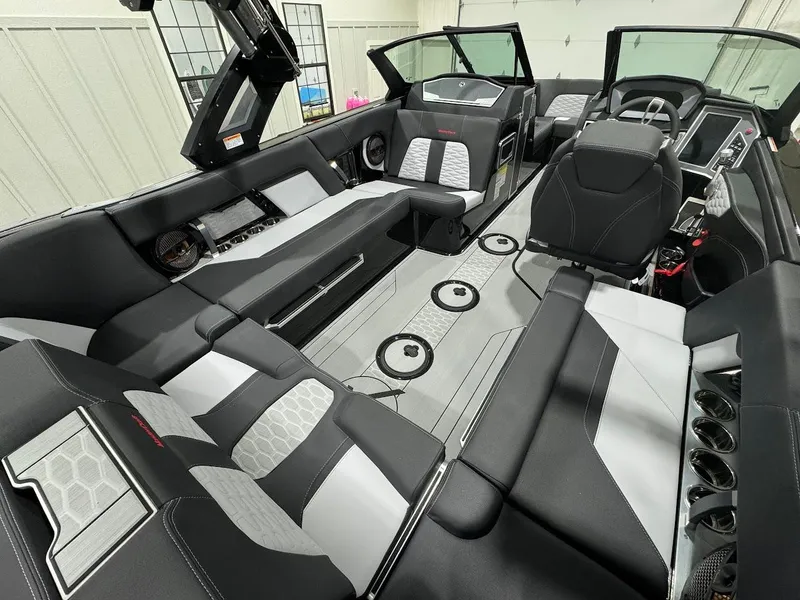 Slide: The Image of 2024 MasterCraft X22 boat interior with luxurious seating and modern design. - 16
