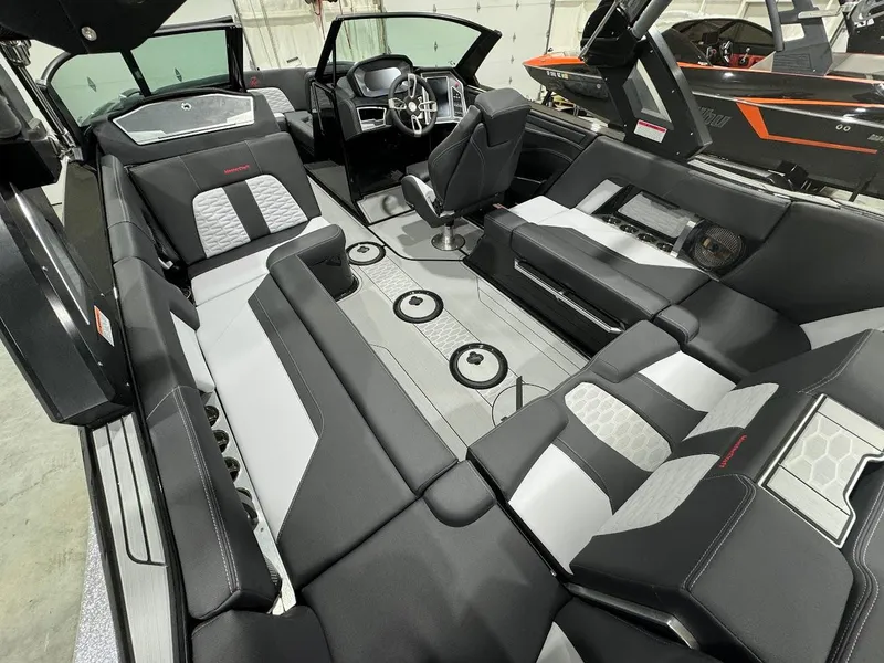 Slide: The Image of 2024 MasterCraft X22 boat interior with luxurious seating and modern design. - 17