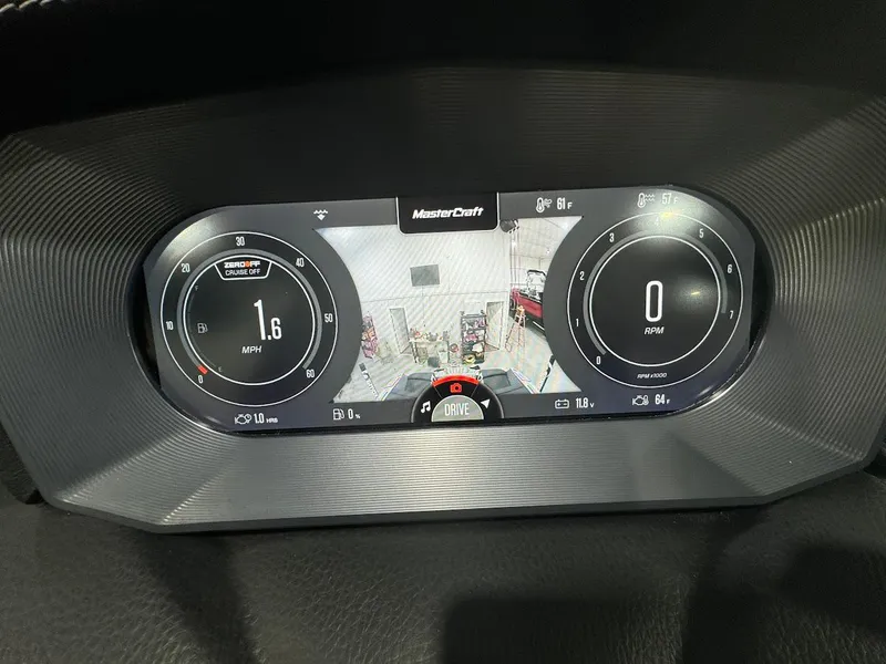 Slide: The Image of 2024 MasterCraft X22 digital dashboard display showing speed and rearview camera. - 19