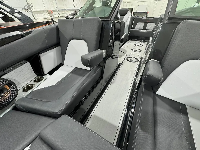 Slide: The Image of 2024 MasterCraft X22 boat interior with luxurious seating and modern design. - 22