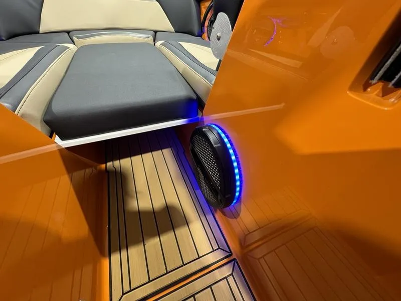 Slide: The Image of 2024 MasterCraft XStar S interior with illuminated speaker and cushioned seating. - 15