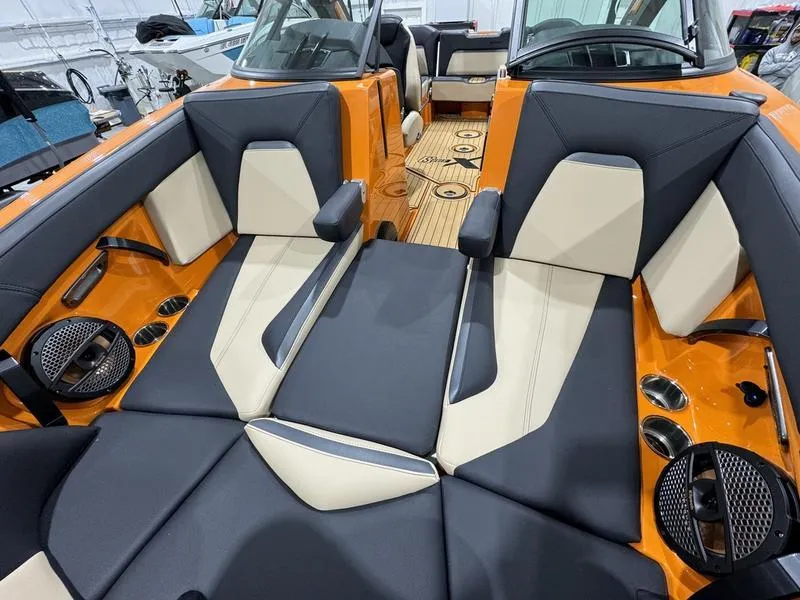 Slide: The Image of 2024 MasterCraft XStar S boat interior with orange and black seating. - 17
