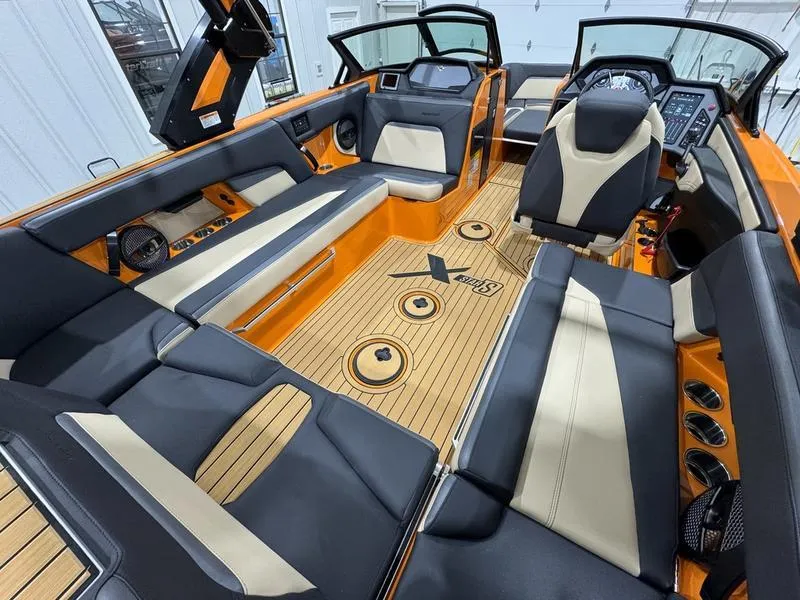 Slide: The Image of 2024 MasterCraft XStar S interior, luxury boat seating and dashboard. - 6