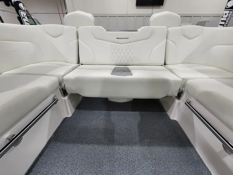 Slide: The Image of 2024 MasterCraft XT24 boat interior with white leather seating. - 19