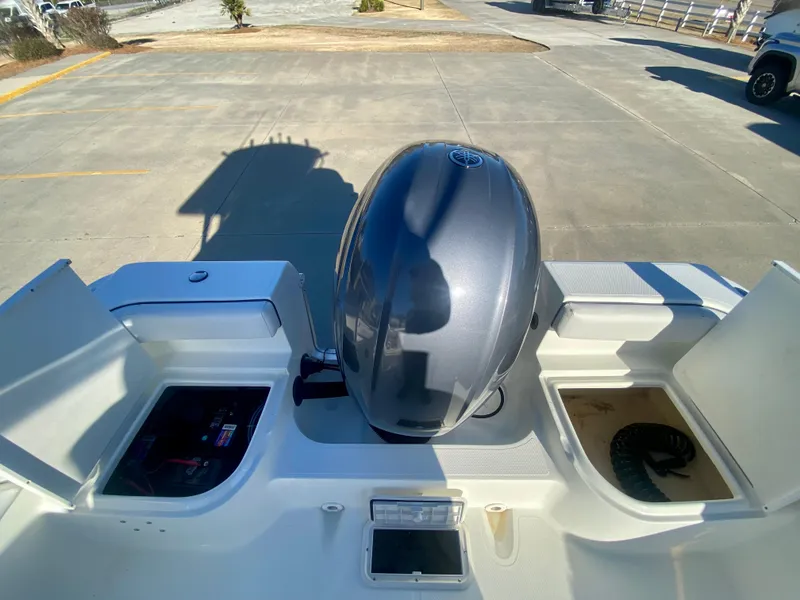 Slide: The Image of 2016 Clearwater 2200CC boat with outboard motor in parking lot. - 6