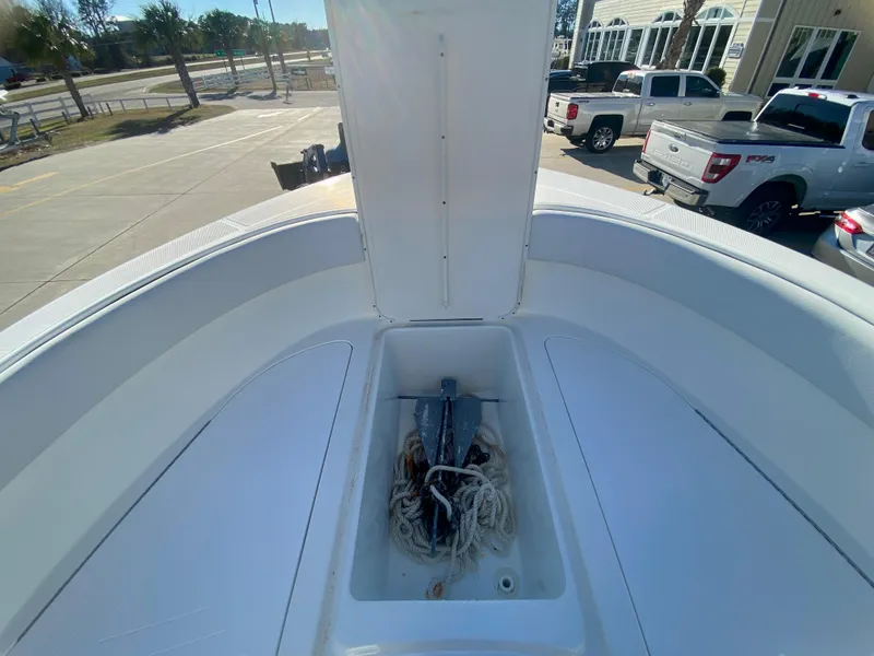 Slide: The Image of 2016 Clearwater 2200CC boat anchor storage compartment. - 22