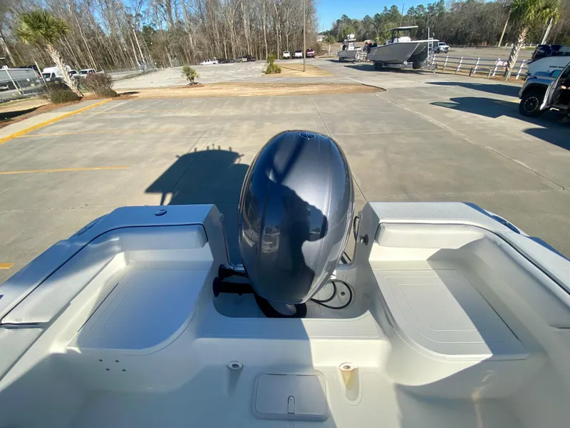 Slide: The Image of 2016 Clearwater 2200CC boat with outboard motor in a parking lot. - 7