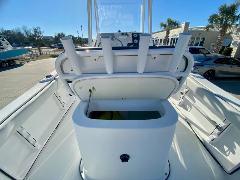 Slide: The Image of 2016 Clearwater 2200CC boat with open storage compartment and rod holders. - 9
