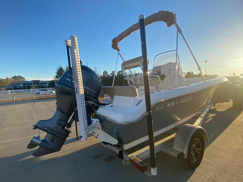 Slide: The Image of 2020 Key West 189 FS boat with outboard motor on trailer. - 3