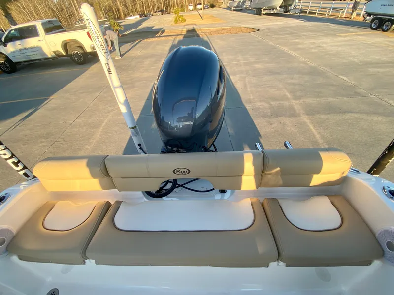 Slide: The Image of 2020 Key West 189 FS boat with beige seating and outboard motor. - 7