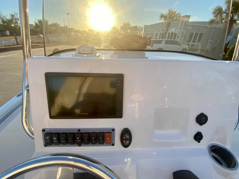 Slide: The Image of 2020 Key West 189 FS boat console with GPS and control panel at sunset. - 11