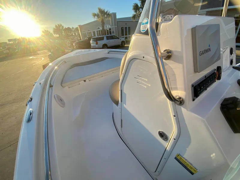 Slide: The Image of 2020 Key West 189 FS boat interior with Garmin navigation system at sunset. - 12