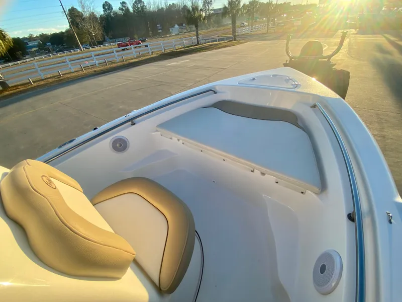 Slide: The Image of 2020 Key West 189 FS boat interior with seating and storage compartments. - 13