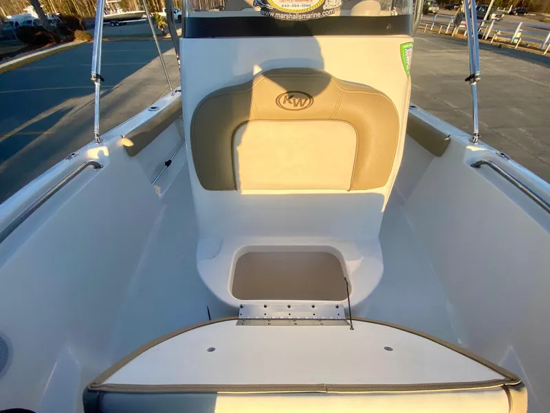 Slide: The Image of 2020 Key West 189 FS boat interior with cushioned seating and storage. - 16