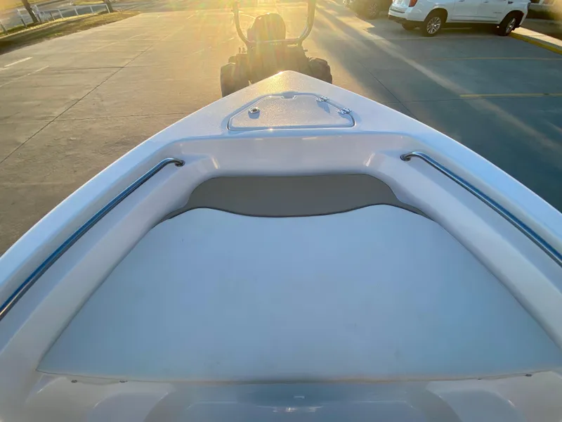Slide: The Image of 2020 Key West 189 FS boat bow with seating and railings at sunset. - 17