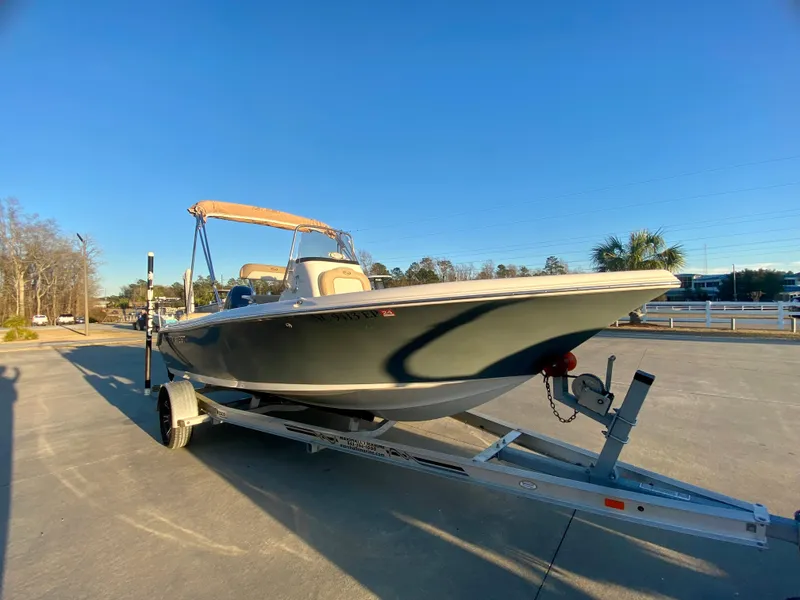 Slide: The Image of 2020 Key West 189 FS boat on a trailer in a parking lot. - 2