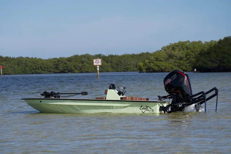 The Image of 2023 Cayo Boatworks 180 in shallow water with outboard motor. - 0