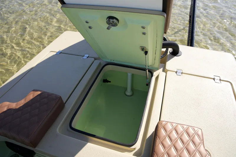 Slide: The Image of 2023 Cayo Boatworks 180 open storage compartment with cushioned seating. - 11