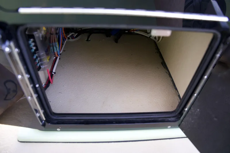 Slide: The Image of 2023 Cayo Boatworks 180 storage compartment with wiring. - 15