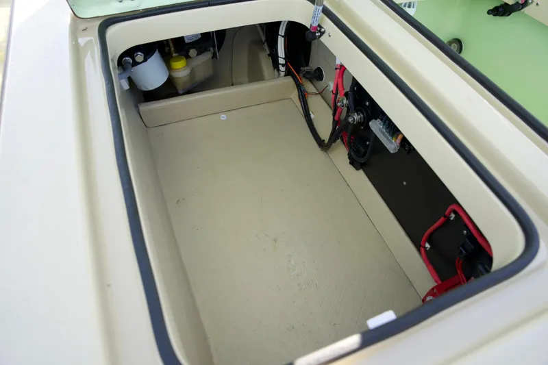 Slide: The Image of 2023 Cayo Boatworks 180 storage compartment with wiring and components. - 16