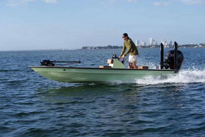 Slide: The Image of 2023 Cayo Boatworks 180 skiff cruising on open water. - 22