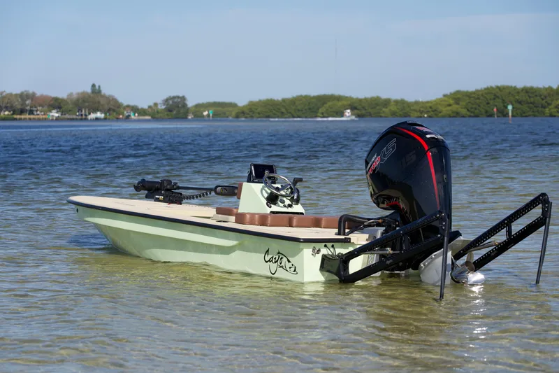 Slide: The Image of 2023 Cayo Boatworks 180 in shallow water with outboard motor. - 23
