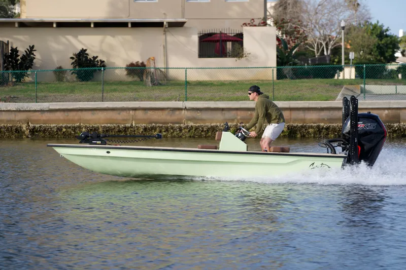 Slide: The Image of 2023 Cayo Boatworks 180 model in action on a calm waterway. - 26