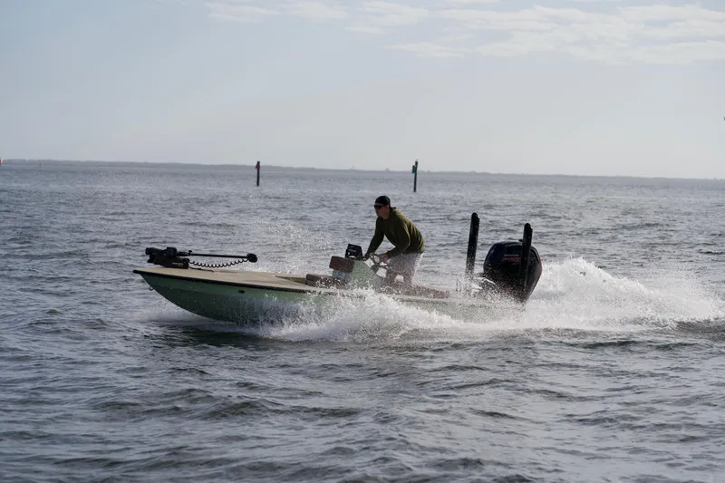 Slide: The Image of 2023 Cayo Boatworks 180 model speeding on open water. - 30