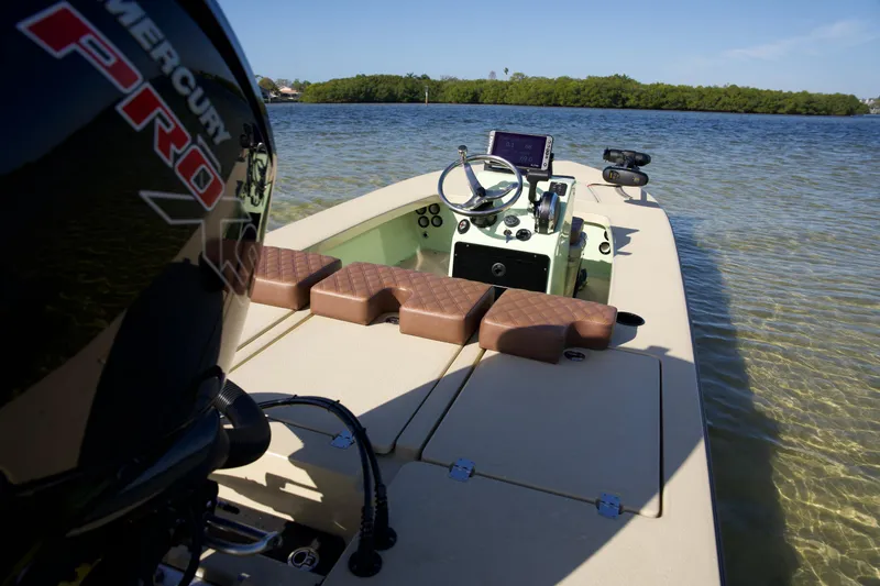 Slide: The Image of 2023 Cayo Boatworks 180 in shallow water, featuring Mercury Pro outboard motor. - 8
