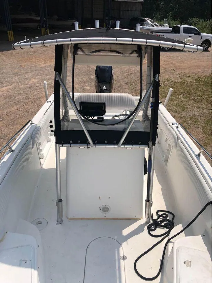 Slide: The Image of 2006 Sea Chaser 245 LX Bay Runner center console boat with T-top and outboard motor. - 7