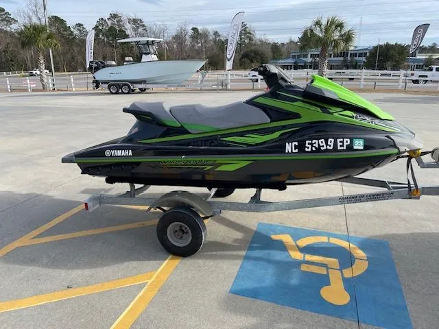 Slide: The Image of 2020 Yamaha WaveRunner VX Deluxe jet ski on a trailer in a parking lot. - 3